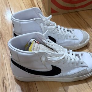 Nike Men’s White High-Top Sneakers with Black Swoosh and Cream Accents